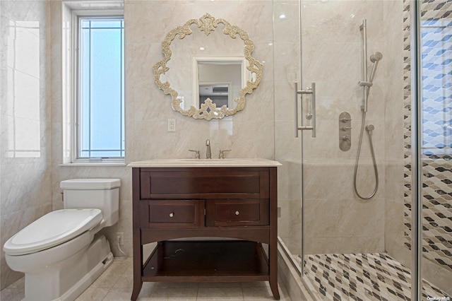 bathroom with toilet, an enclosed shower, and tile walls