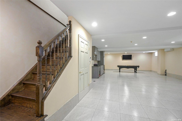 staircase featuring a wall mounted air conditioner and pool table