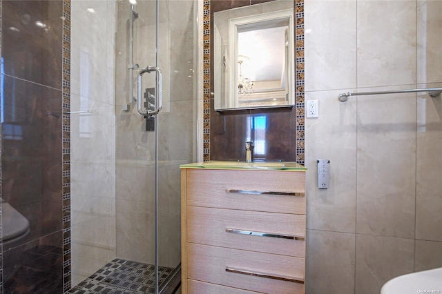 bathroom featuring vanity, toilet, and an enclosed shower