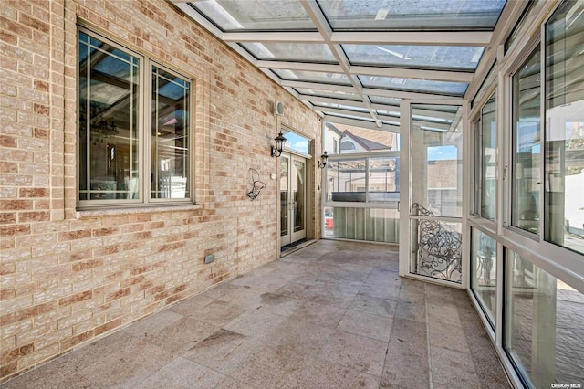 unfurnished sunroom with coffered ceiling