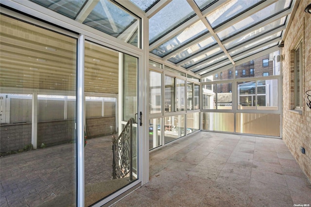 unfurnished sunroom with vaulted ceiling