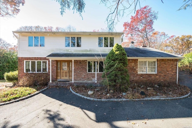 view of front property featuring covered porch