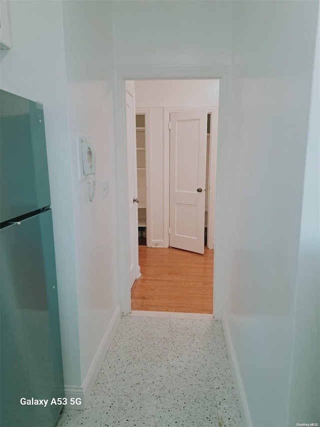 corridor featuring hardwood / wood-style floors