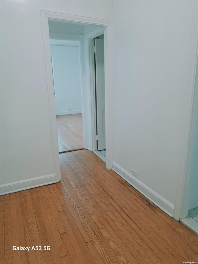 spare room with light hardwood / wood-style floors