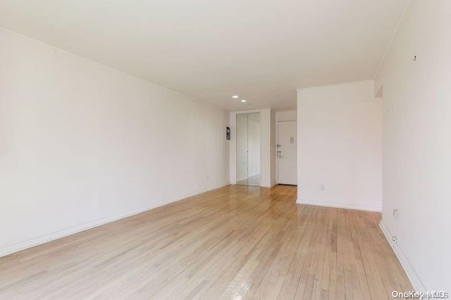 unfurnished room with light hardwood / wood-style flooring