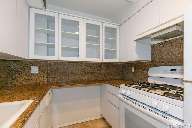 kitchen with white cabinetry and white gas range