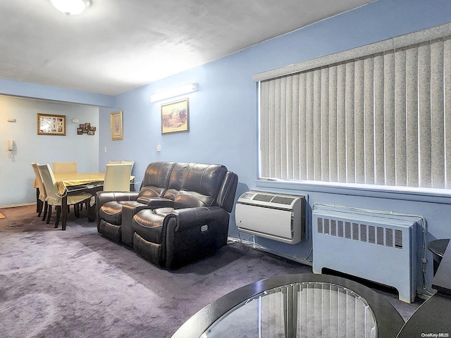 carpeted living room featuring radiator heating unit and an AC wall unit