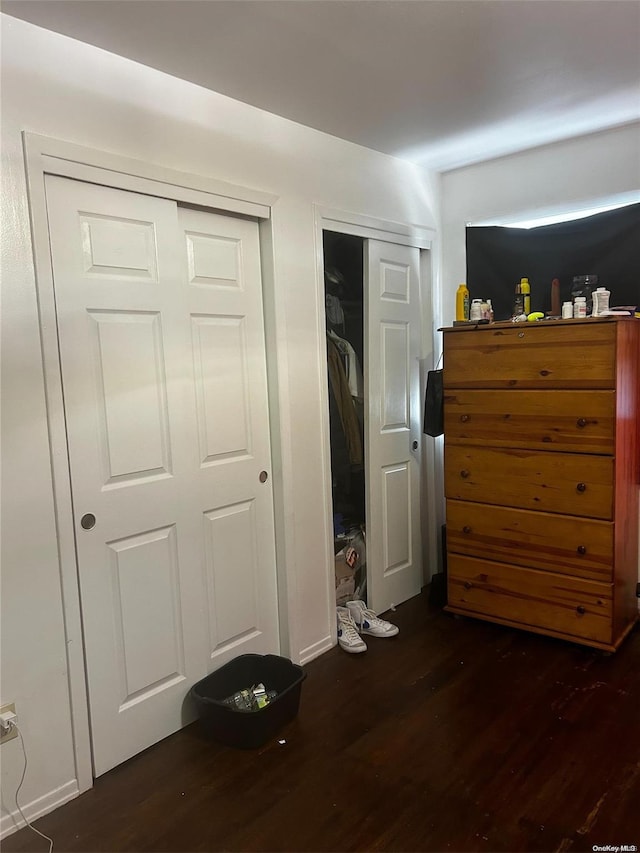 bedroom featuring dark wood-type flooring