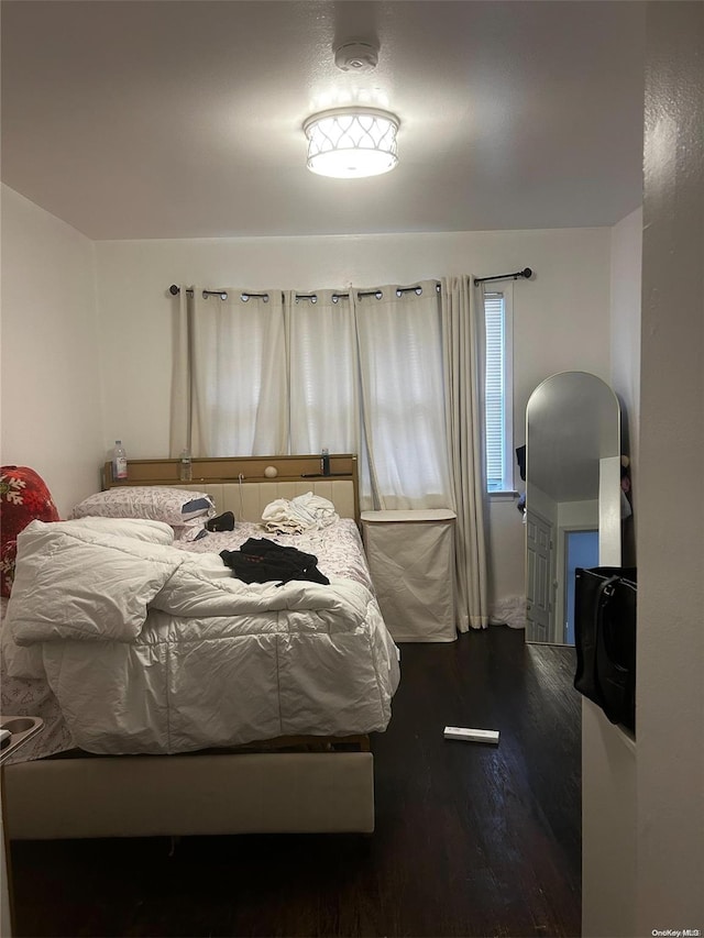 bedroom featuring dark hardwood / wood-style flooring