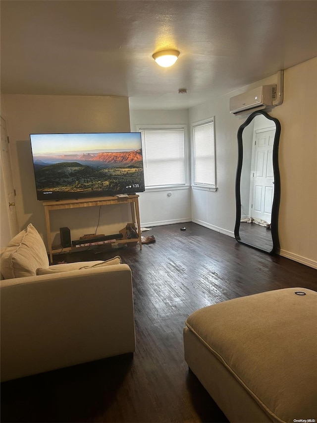 living room featuring dark hardwood / wood-style flooring and a wall unit AC