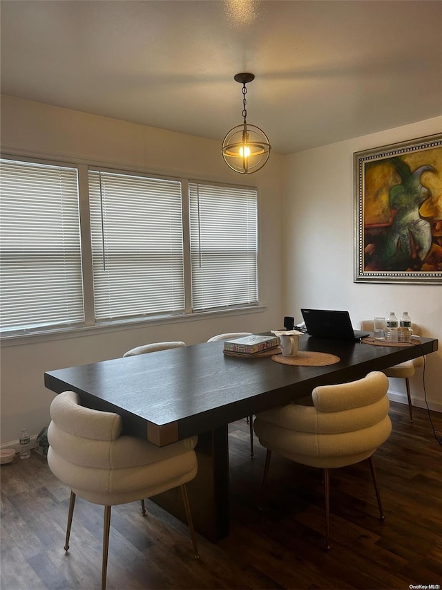 dining room with dark hardwood / wood-style flooring