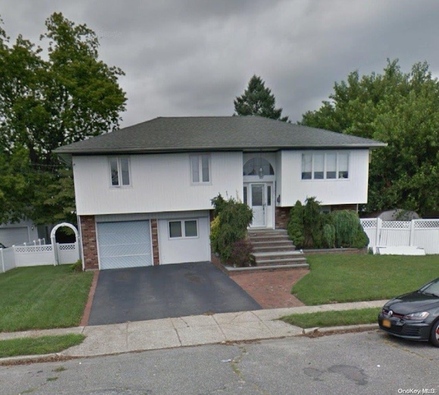 148 3rd St, Hicksville, NY 11801 - raised ranch with a garage and a front yard