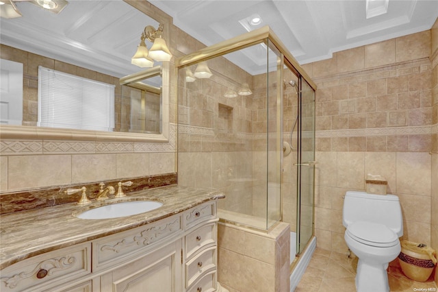 bathroom with vanity, a shower with door, crown molding, toilet, and tile walls