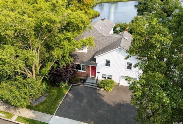 birds eye view of property with a water view