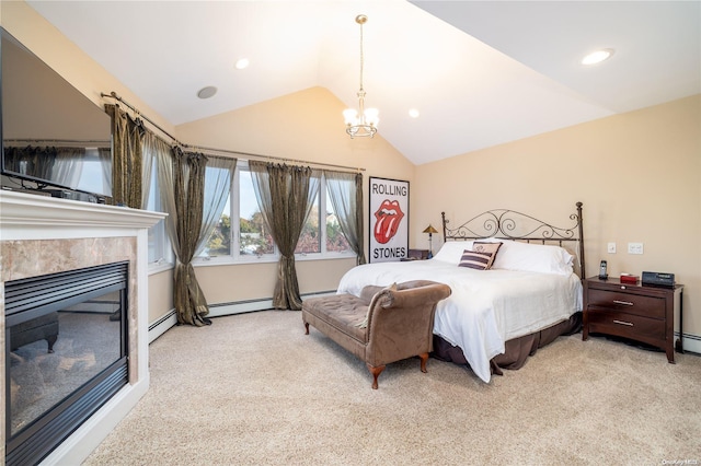 carpeted bedroom featuring a tiled fireplace, a baseboard radiator, vaulted ceiling, and a notable chandelier