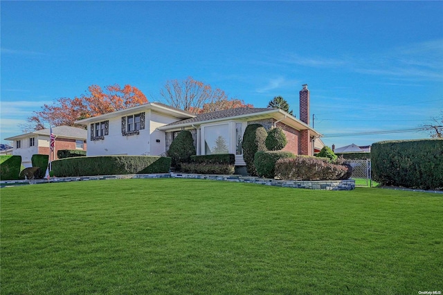 view of front of home with a front yard