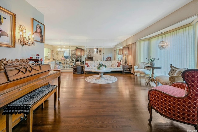 living room featuring wood-type flooring and a notable chandelier