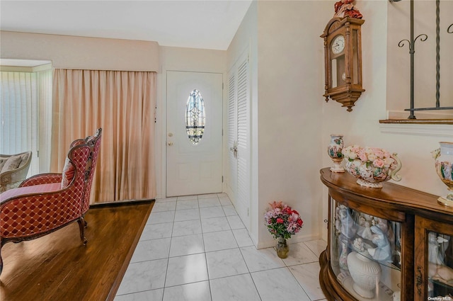 foyer entrance featuring light tile patterned floors