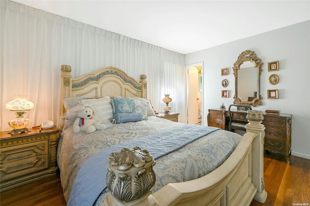 bedroom featuring dark hardwood / wood-style flooring