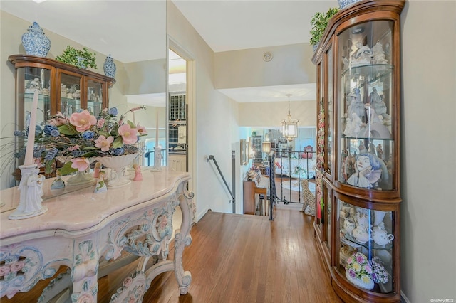 interior space featuring plenty of natural light, a chandelier, and light hardwood / wood-style flooring