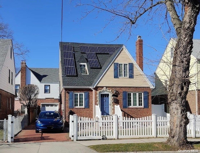 view of front of property with solar panels