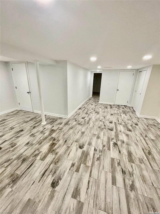 basement featuring light hardwood / wood-style floors