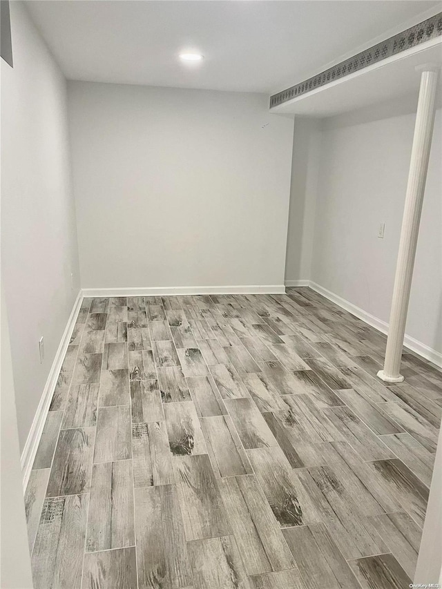 basement featuring wood-type flooring