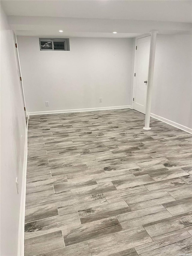 basement featuring light hardwood / wood-style flooring