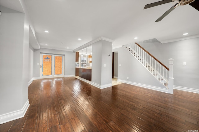 unfurnished living room with wood-type flooring, ceiling fan, and ornamental molding