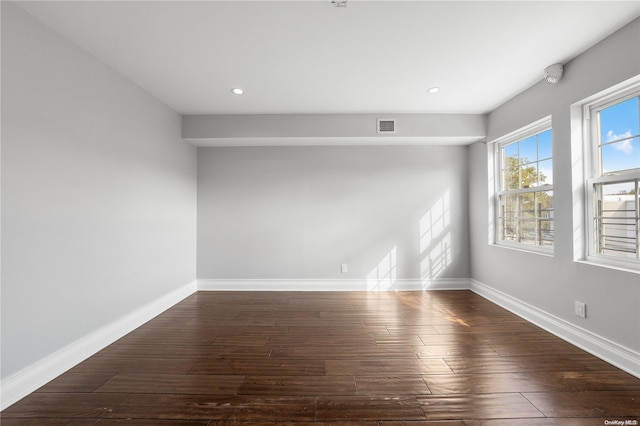 unfurnished room featuring dark hardwood / wood-style floors