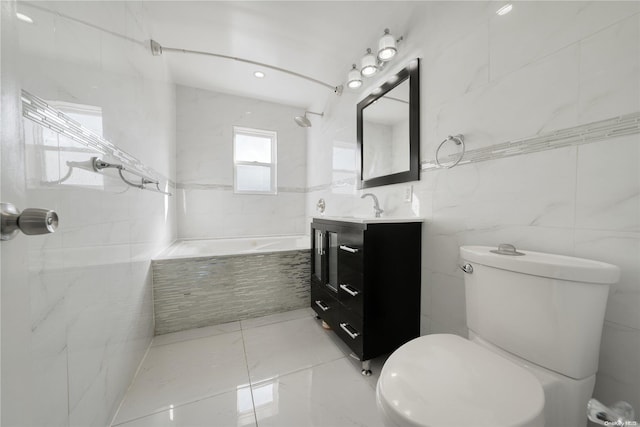 bathroom with vanity, tile walls, and toilet