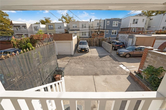 exterior space featuring an outbuilding and a garage