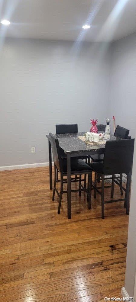 dining area with hardwood / wood-style flooring