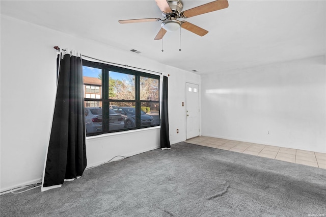 carpeted empty room with ceiling fan