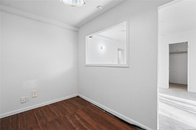 spare room with dark hardwood / wood-style floors