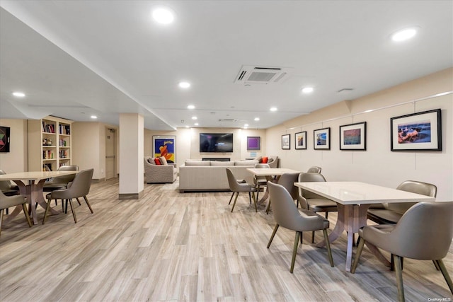 dining area with light hardwood / wood-style floors