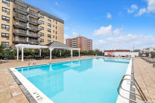 view of swimming pool with a pergola, a gazebo, and a patio