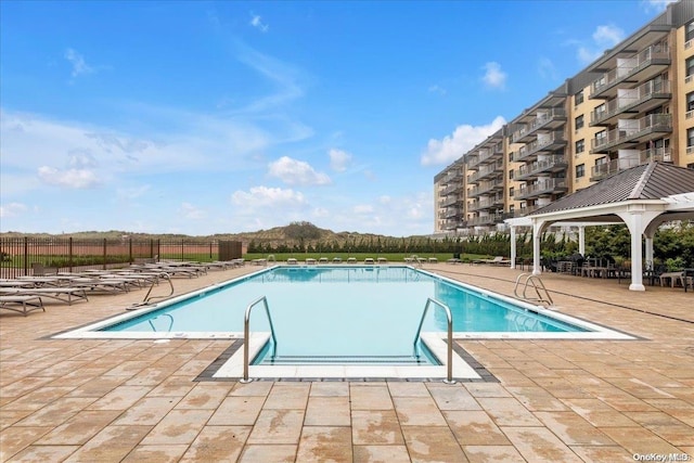 view of pool featuring a gazebo and a patio area