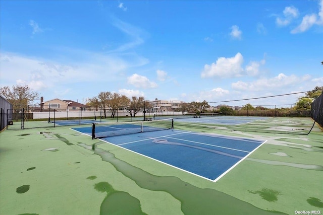 view of sport court with basketball hoop