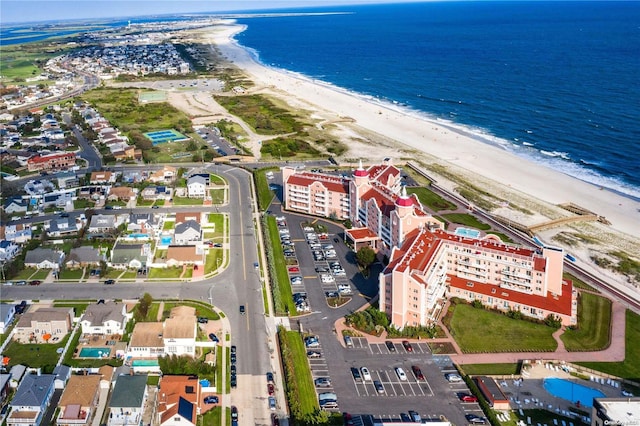 birds eye view of property with a view of the beach and a water view