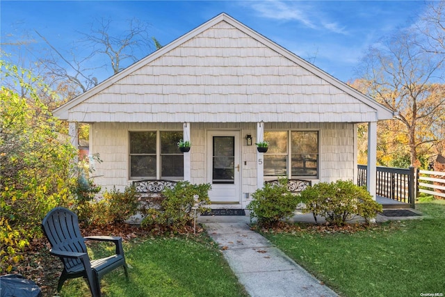 bungalow-style house featuring a front yard and a porch