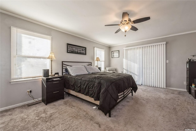 carpeted bedroom with ceiling fan and crown molding