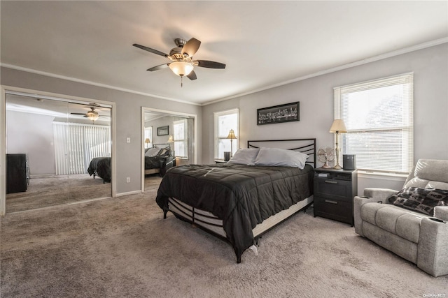 carpeted bedroom featuring ceiling fan and crown molding