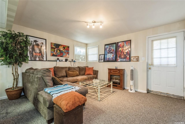 carpeted living room featuring plenty of natural light and a fireplace