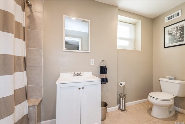 bathroom featuring tile patterned floors, toilet, vanity, and a shower with shower curtain