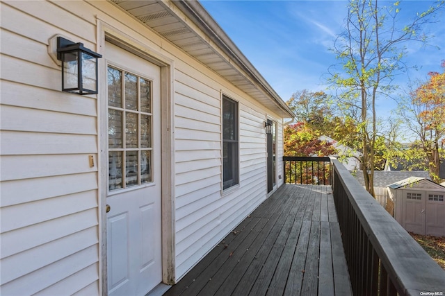 wooden terrace with a shed