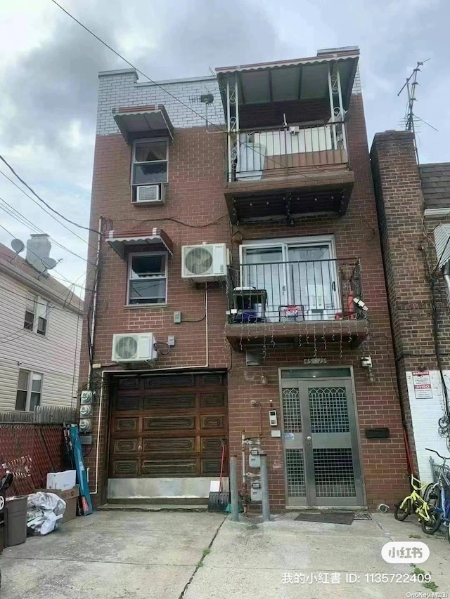 exterior space featuring a balcony and ac unit