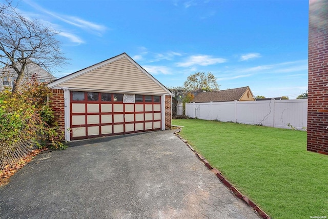 garage with a lawn