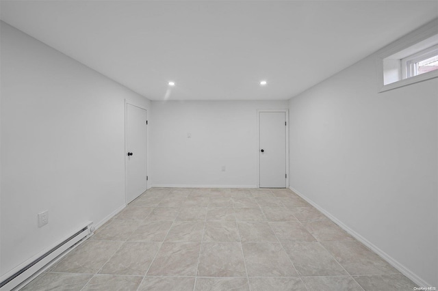 empty room featuring a baseboard heating unit