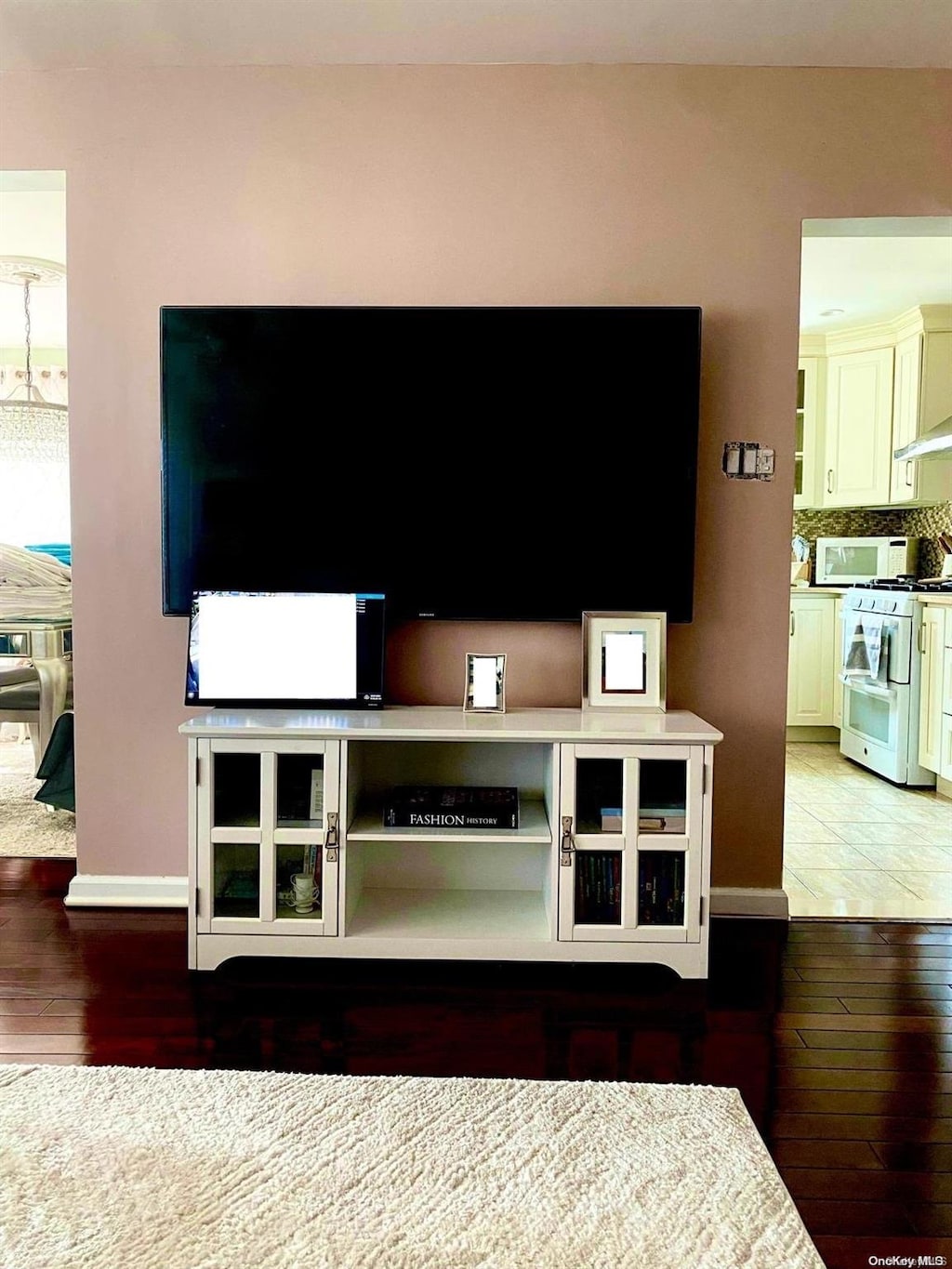 unfurnished living room featuring hardwood / wood-style floors